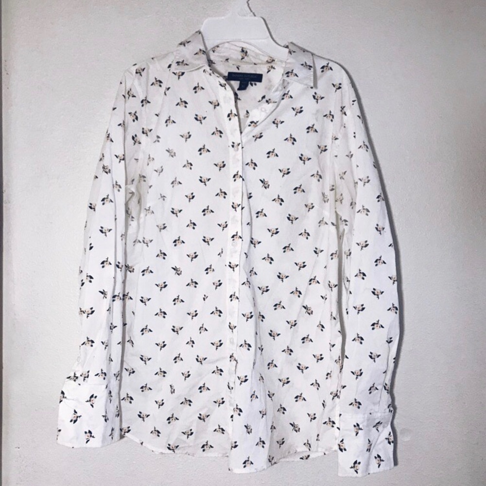 White button down with a flower pattern.